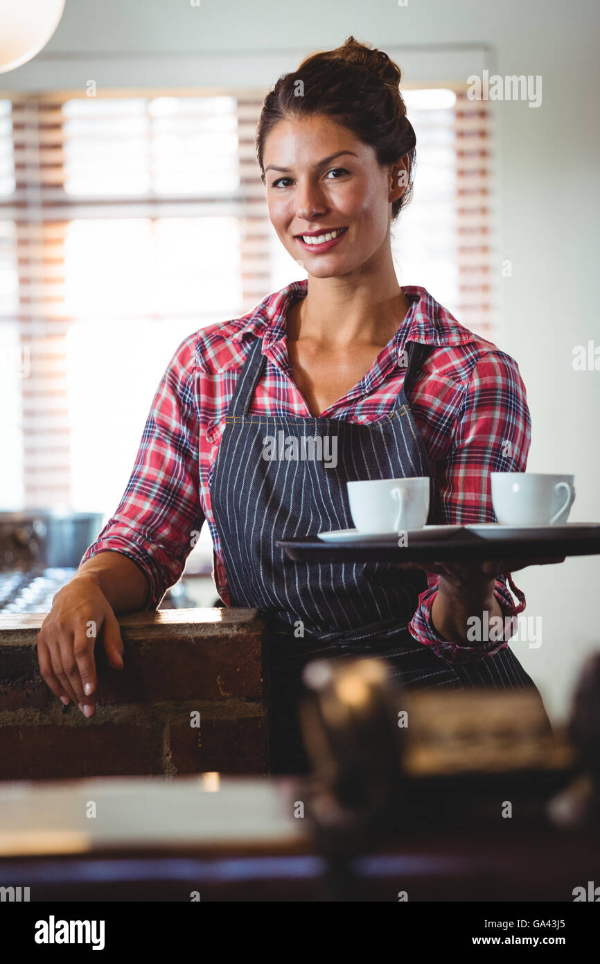 Waitress holding coffees Stock Photo