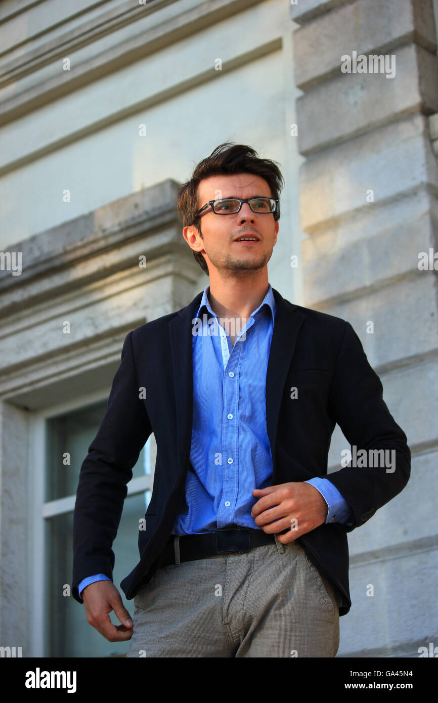 Man in suit with glasses hurry late Stock Photo