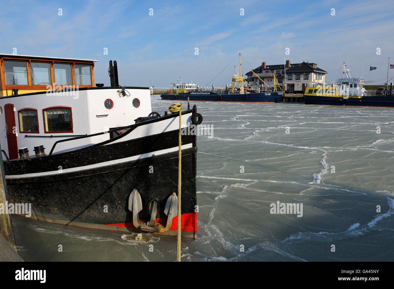Harbour of Oudeschild in winter, Texel, Netherlands Stock Photo