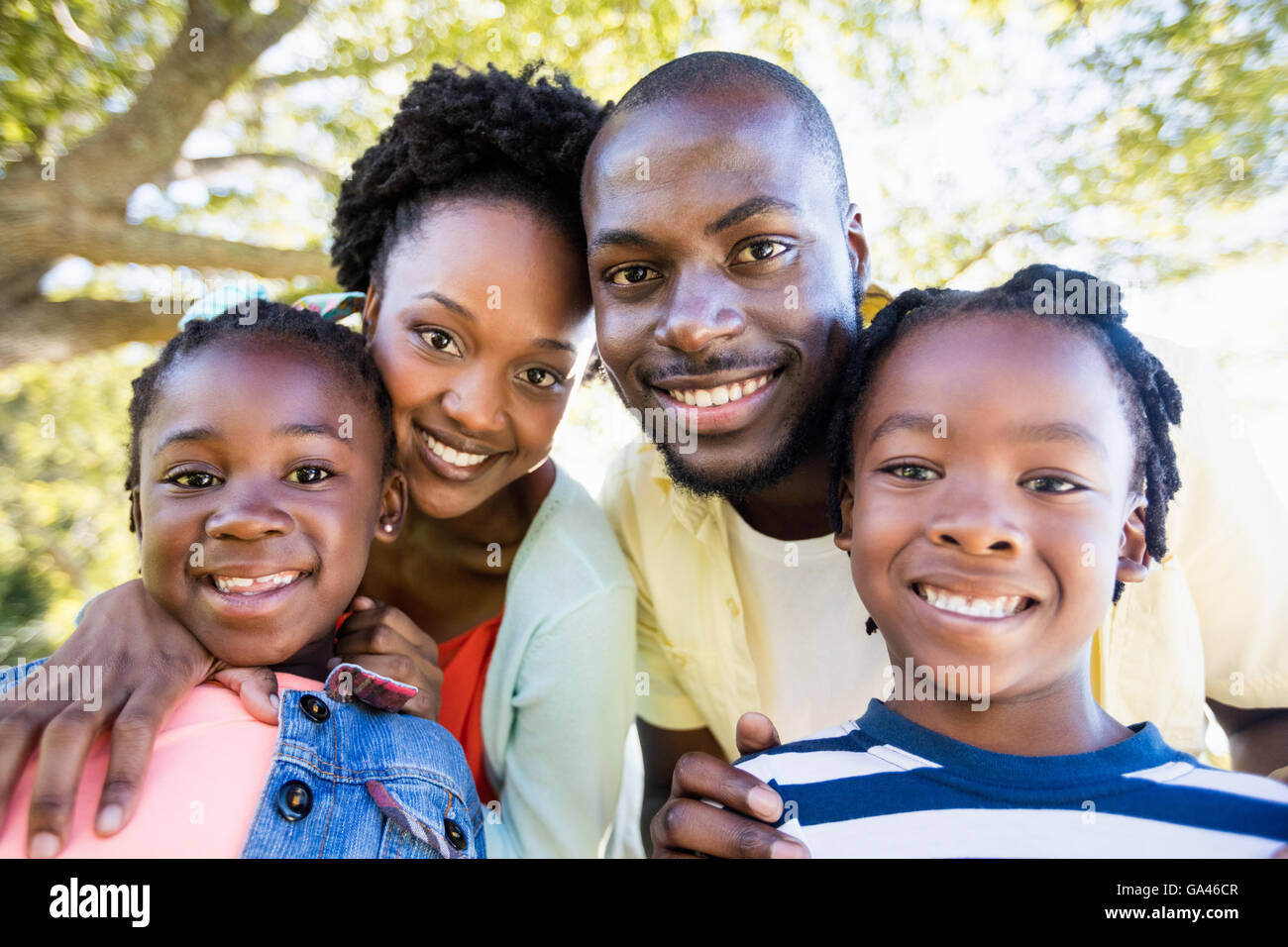 Happy family posing together Stock Photo - Alamy