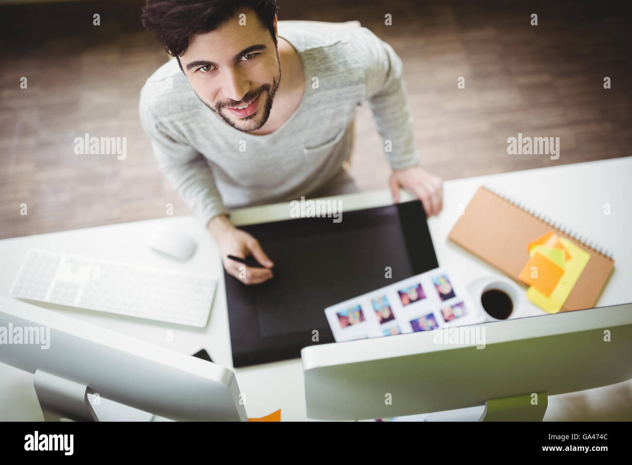 Portrait of businessman using graphics tablet in office Stock Photo - Alamy