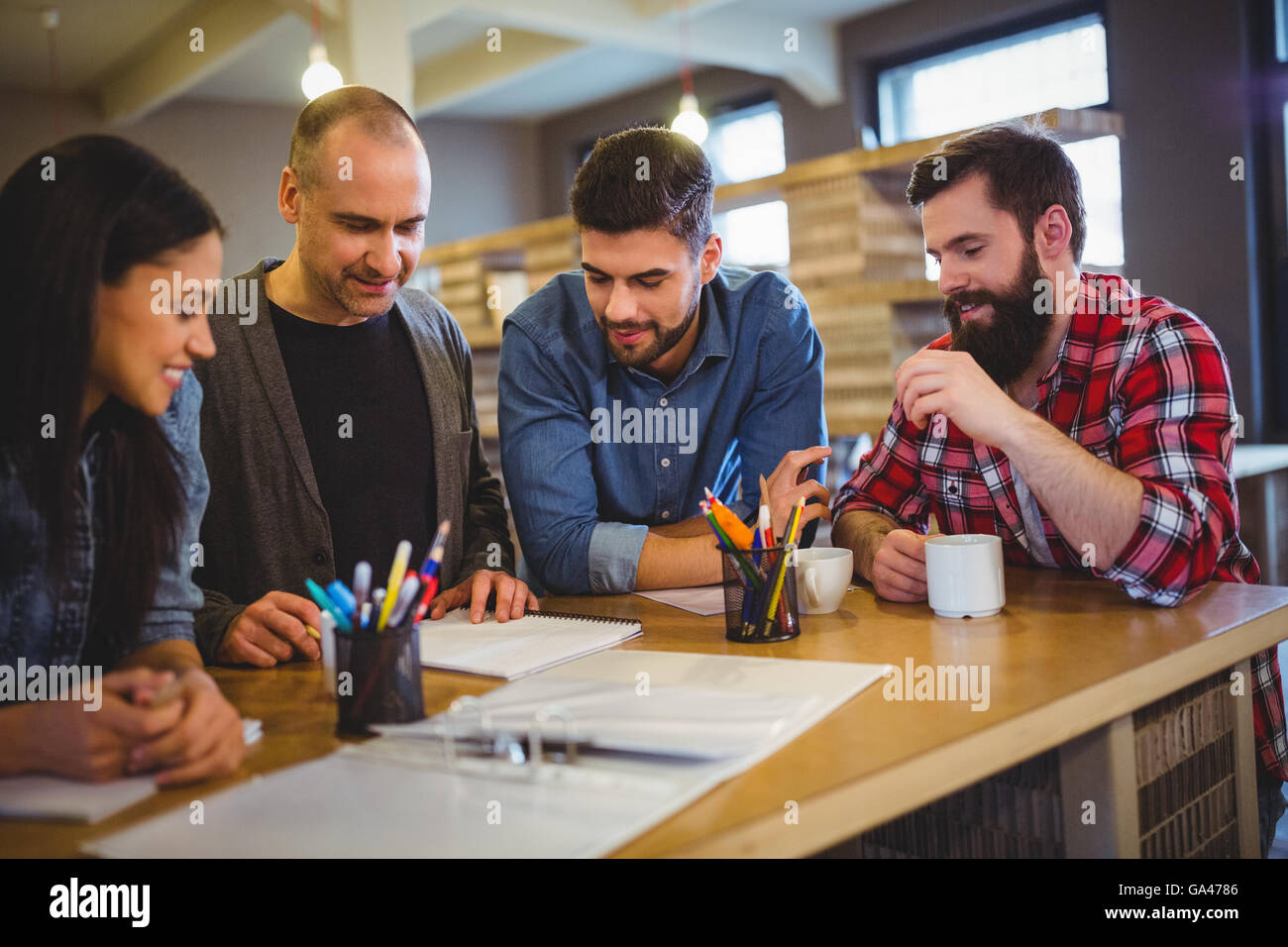 Creative business people discussing at table Stock Photo