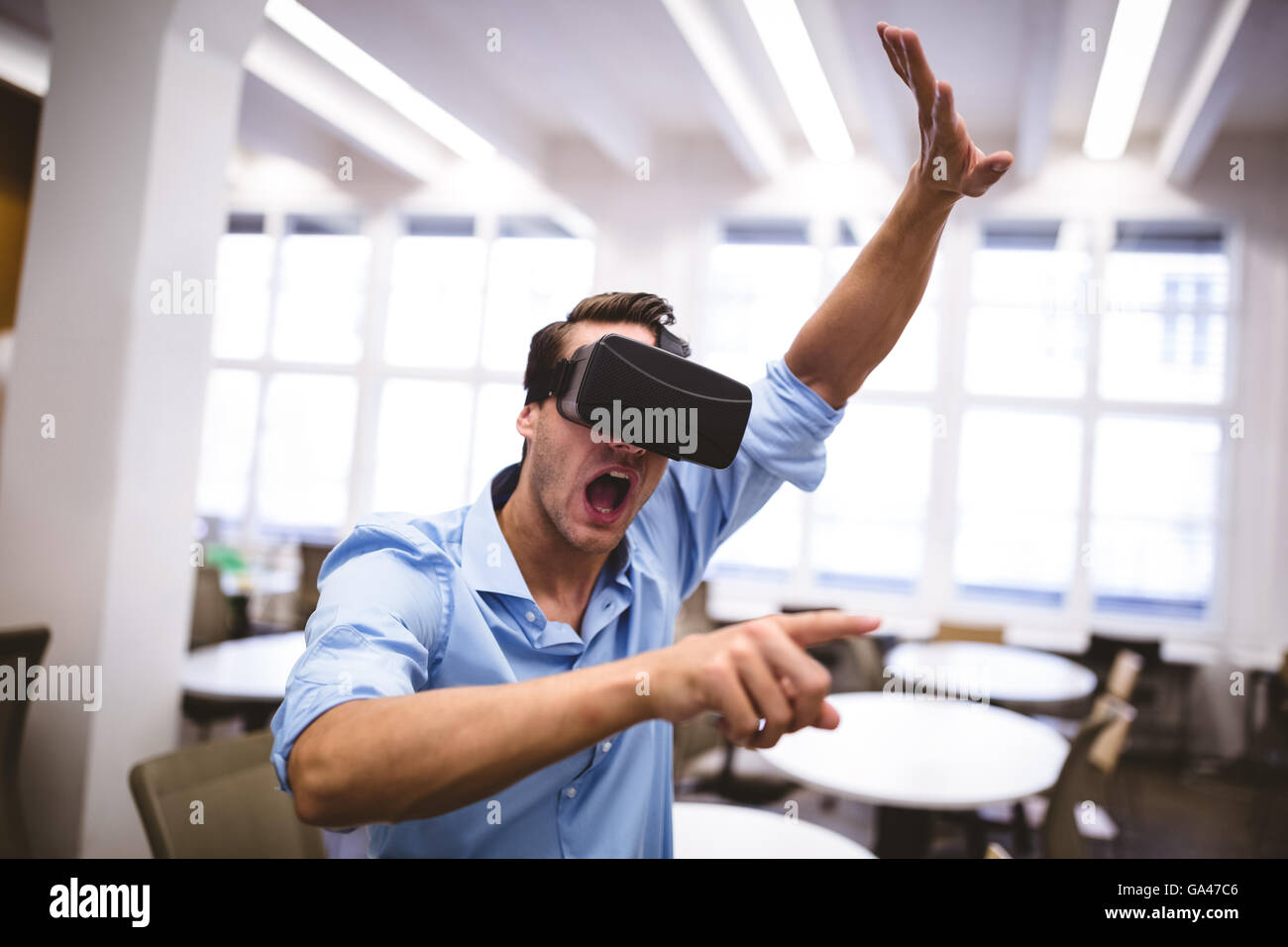 Executive enjoying augmented reality headset at office Stock Photo Alamy
