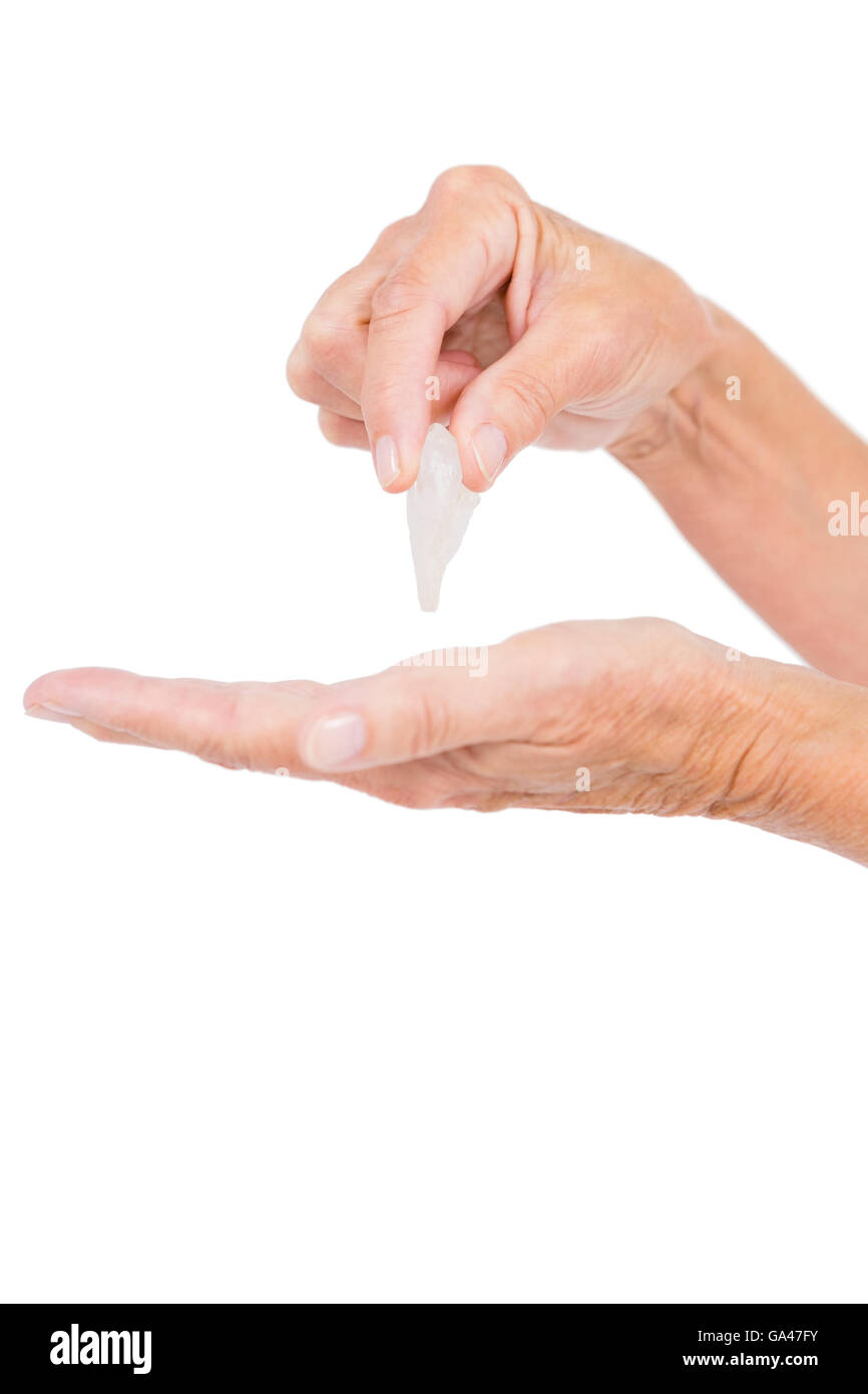 Cropped image of person holding pebble Stock Photo