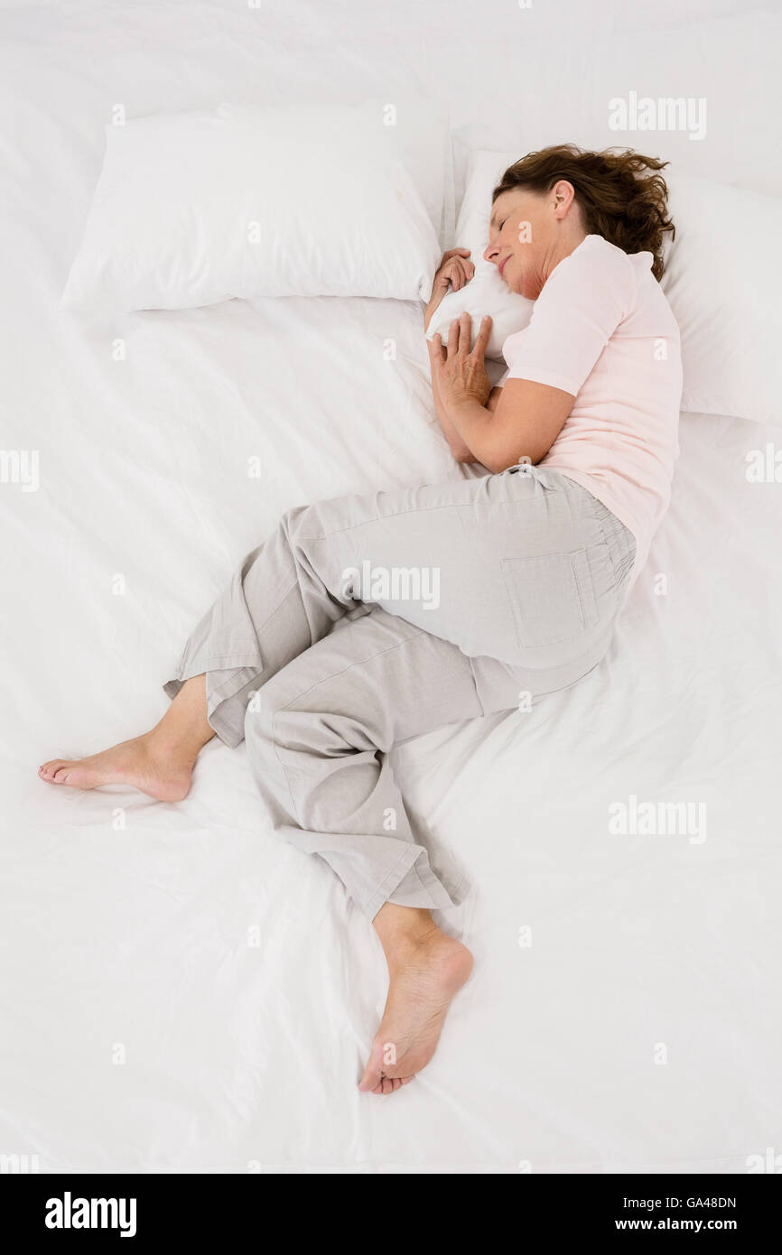 Mature woman sleeping bed hi-res stock photography and images - Alamy