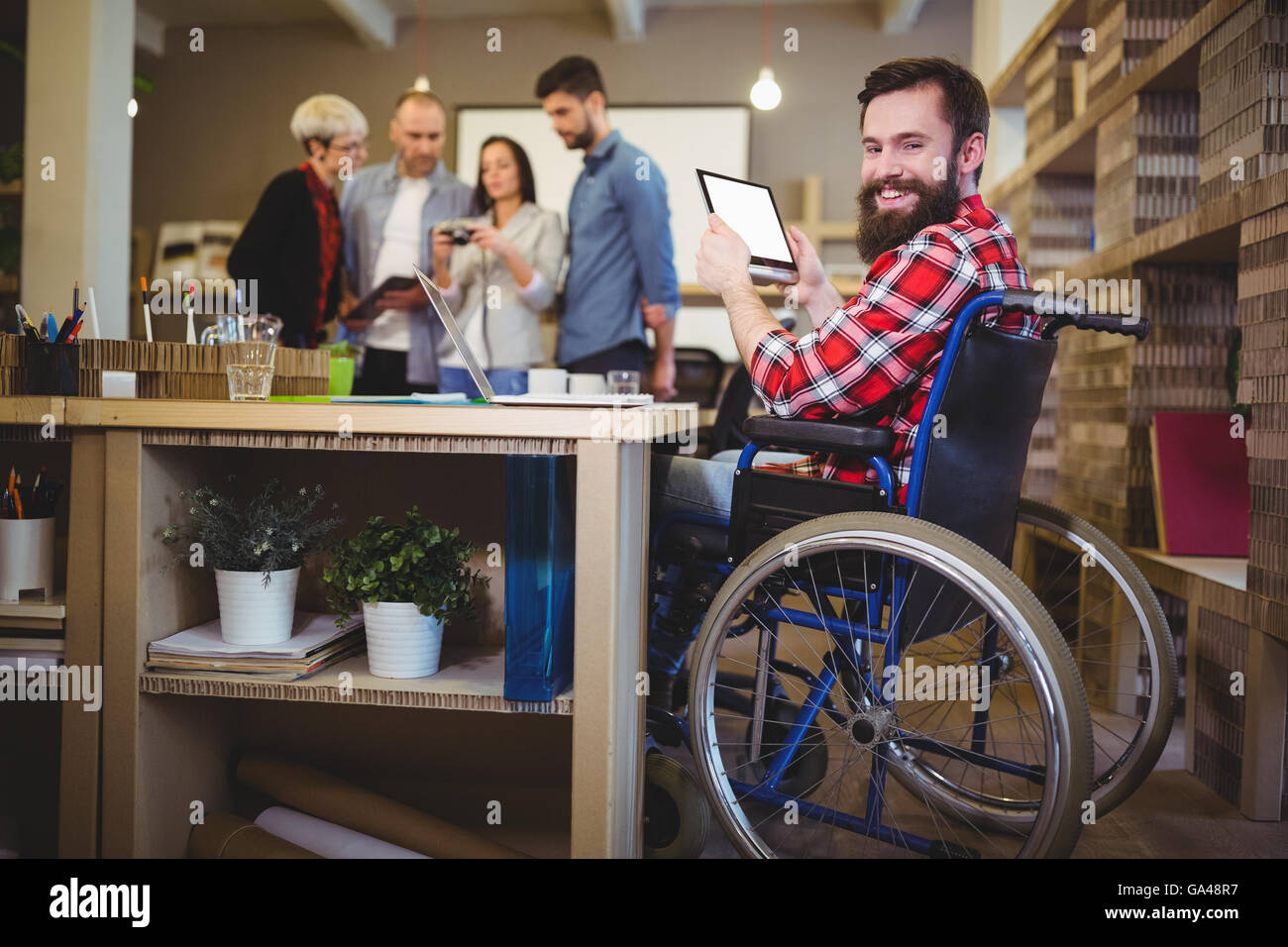 Portrait of disabled businessman using digital tablet Stock Photo