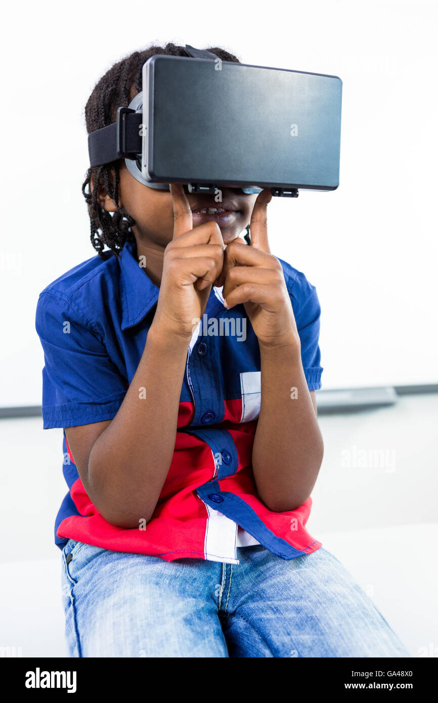 Boy using virtual reality headset in classroom Stock Photo Alamy