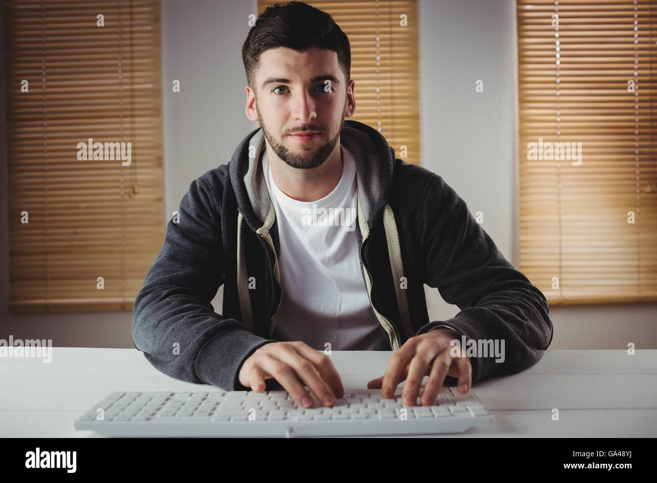 Portrait of young man working in office Stock Photo