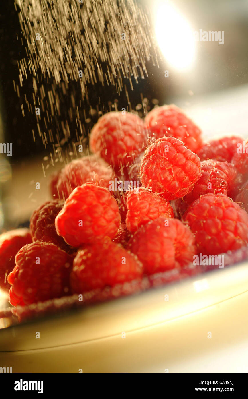 Raspberries and caster sugar Stock Photo Alamy
