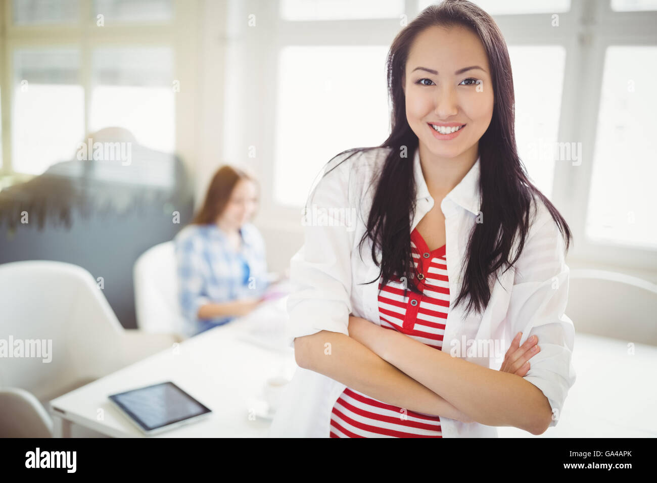 Portrait of smiling businesswoman at creative office Stock Photo - Alamy