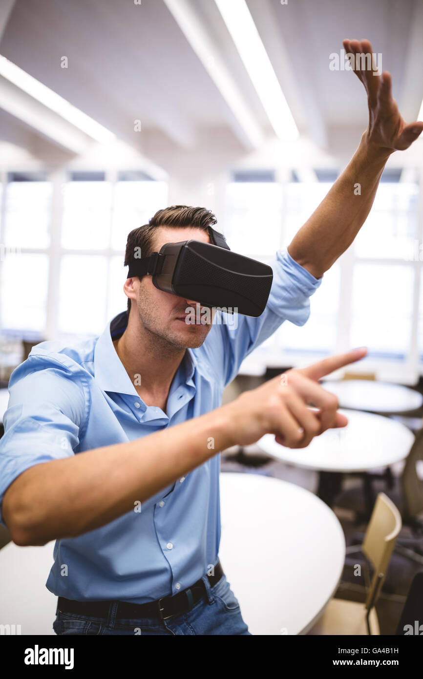 Executive enjoying virtual reality headset at office Stock Photo