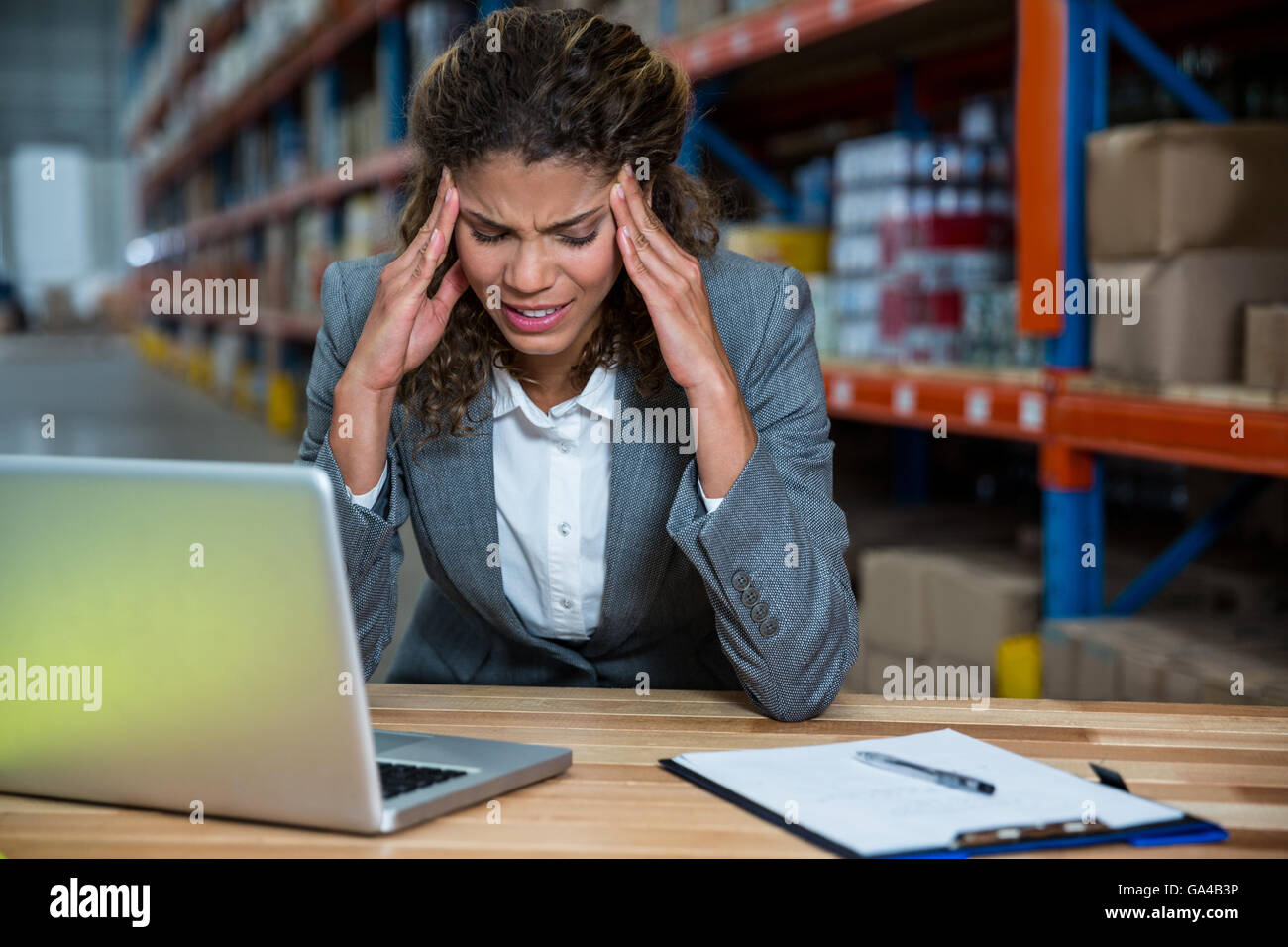 Business woman is stressed because of work Stock Photo