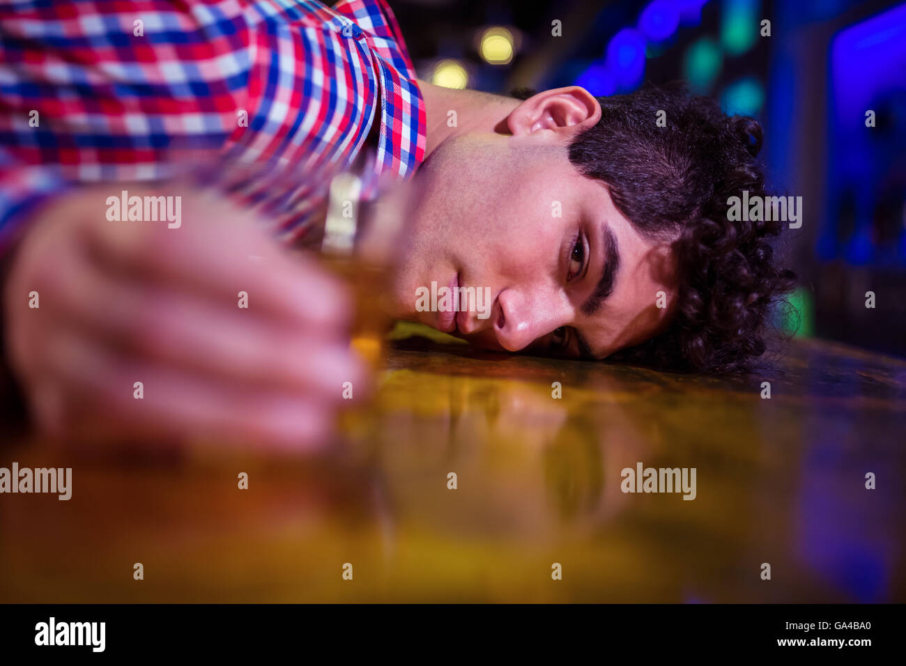 Portrait of drunk man at bar counter Stock Photo