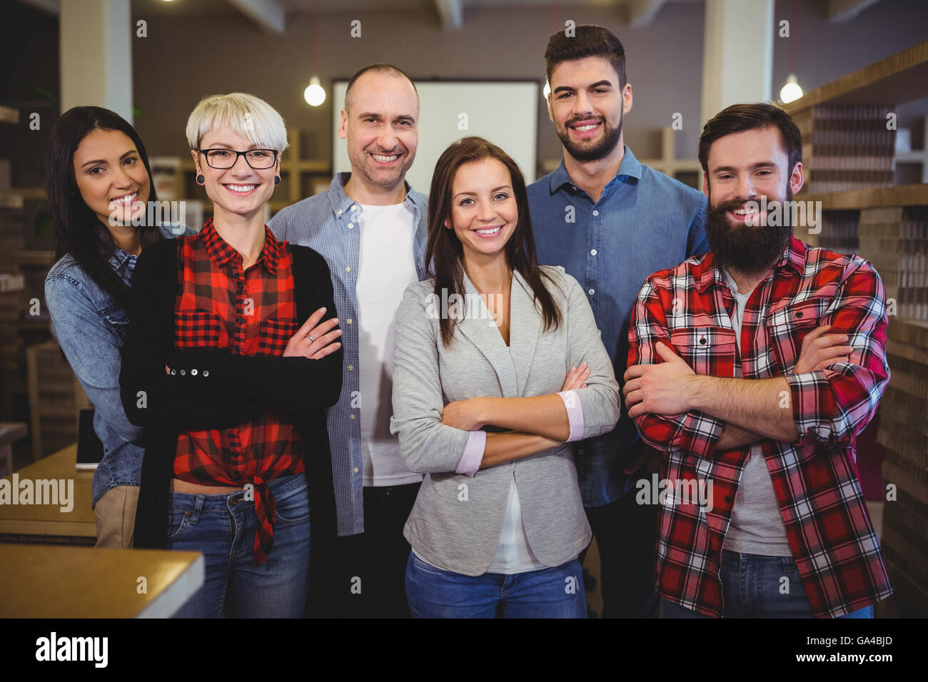 Happy confident business people in creative office Stock Photo