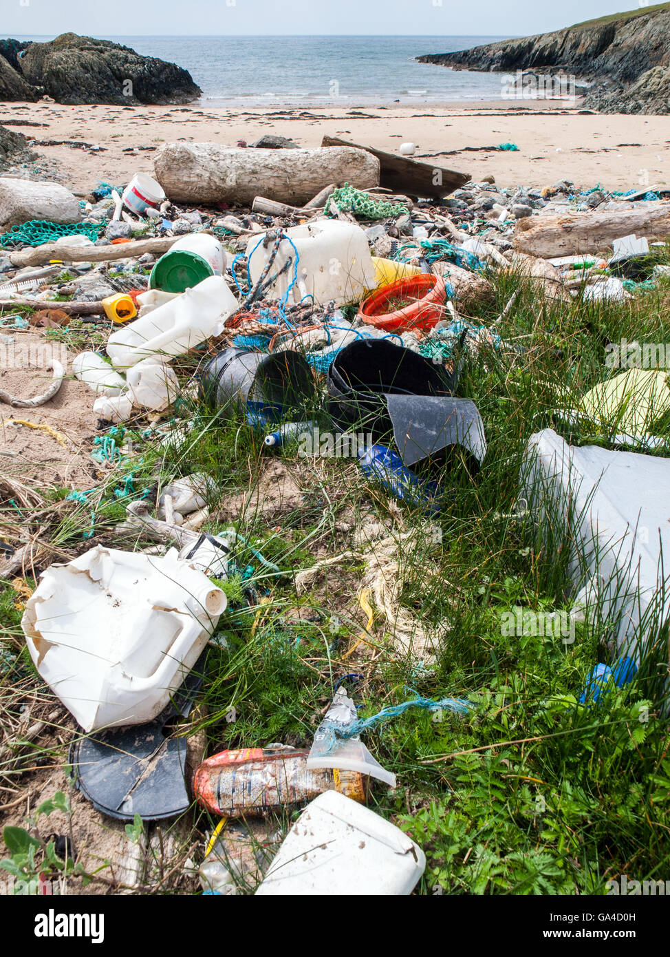 Plastic waste and other sea borne pollution on a Welsh beach Stock Photo