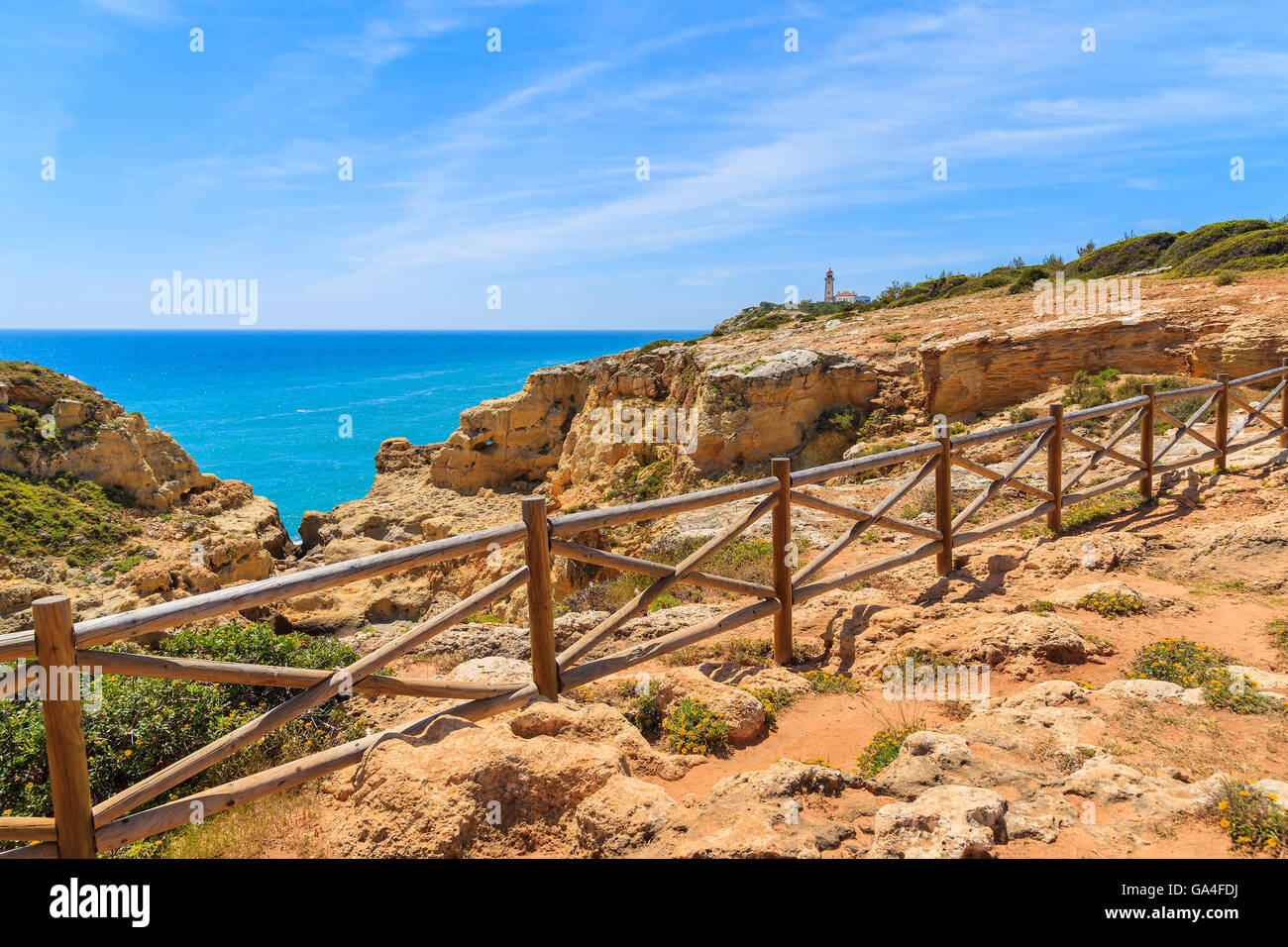 Blue sea and cliff path on coast of Portugal, Algarve region Stock Photo