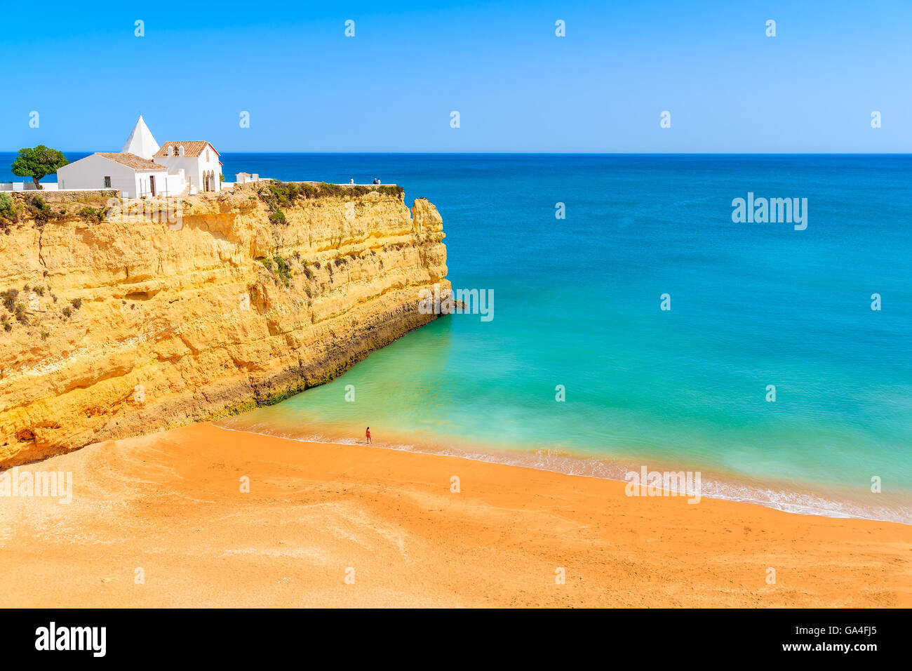 White small church on top of cliff at Armacao de Pera beach, Algarve region, Portugal Stock Photo