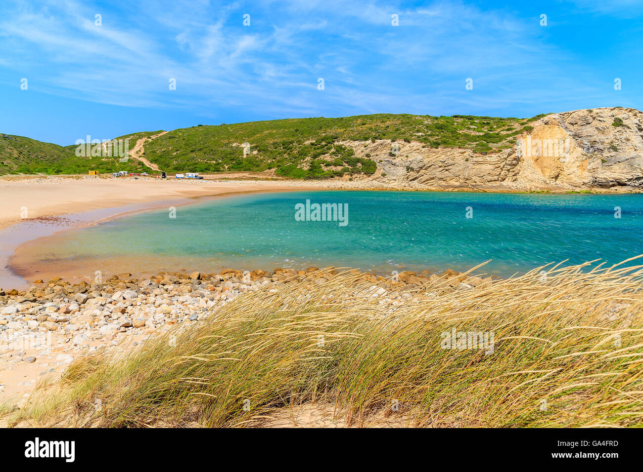 Grass on beautiful sandy Barranco beach, Portugal Stock Photo