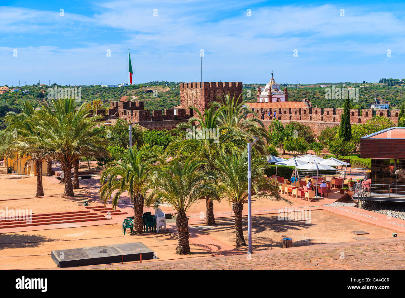 Palm trees on square of medieval castle in Silves town, Algarve region, Portugal Stock Photo