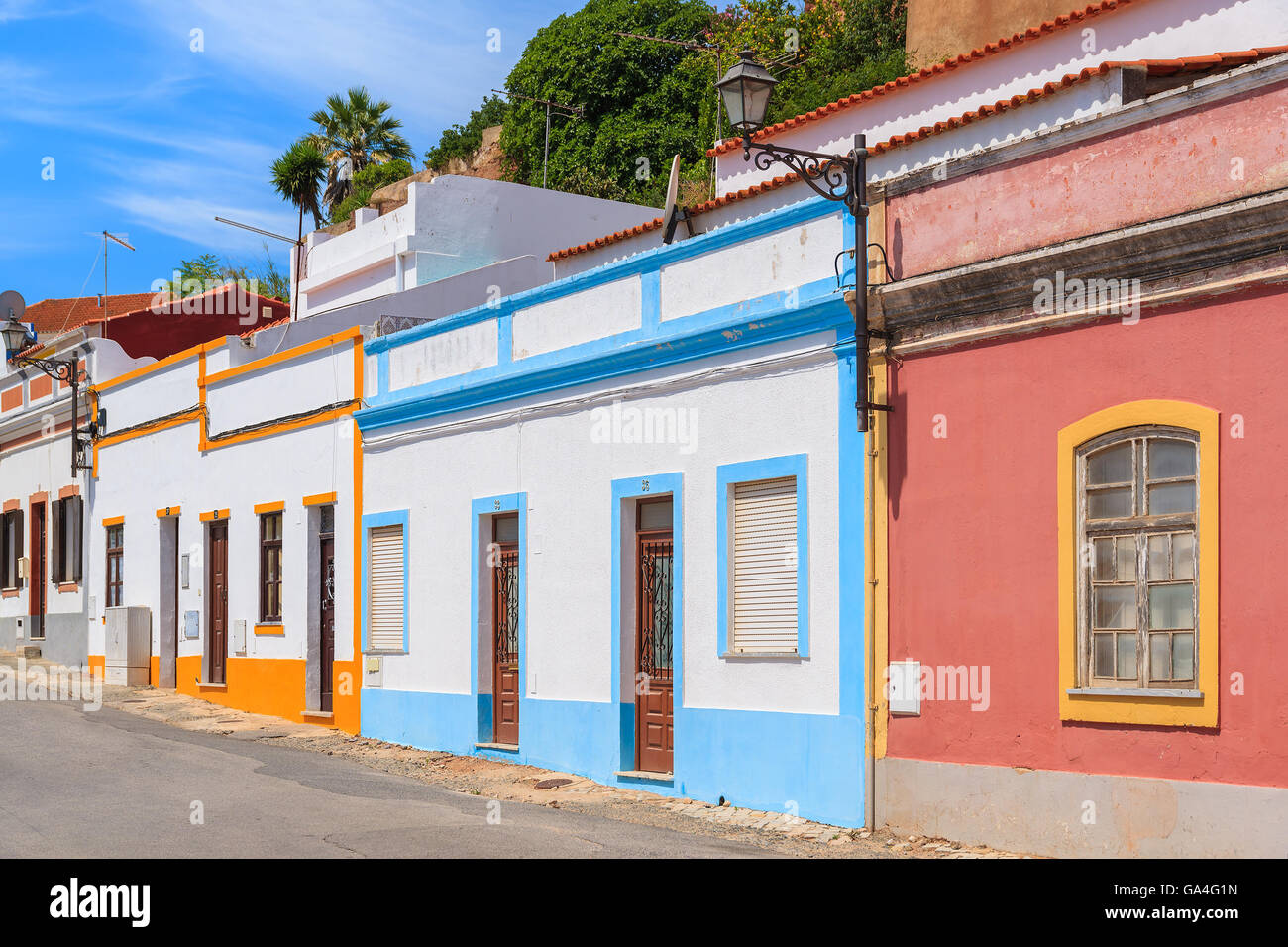 Colorful houses along a street in Portuguese historic town of Silves, Algarve region, Portugal Stock Photo