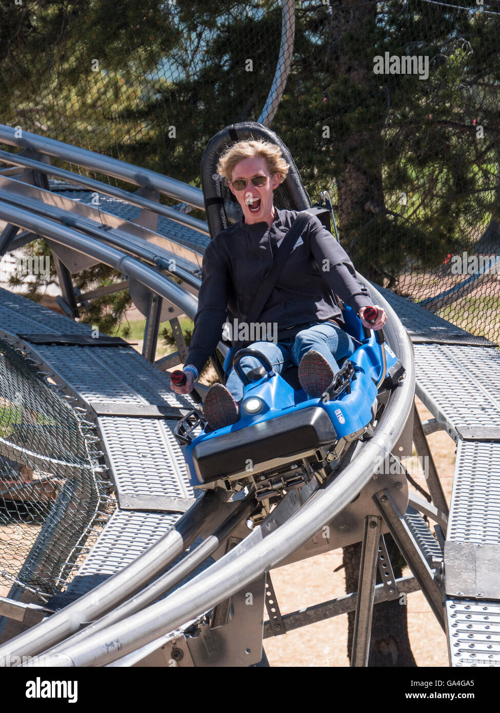 Guest screams on the Forest Flyer Alpine Coaster, Epic Discovery center at Eagle's Nest, Vail Ski Resort, Vail, Colorado. Stock Photo