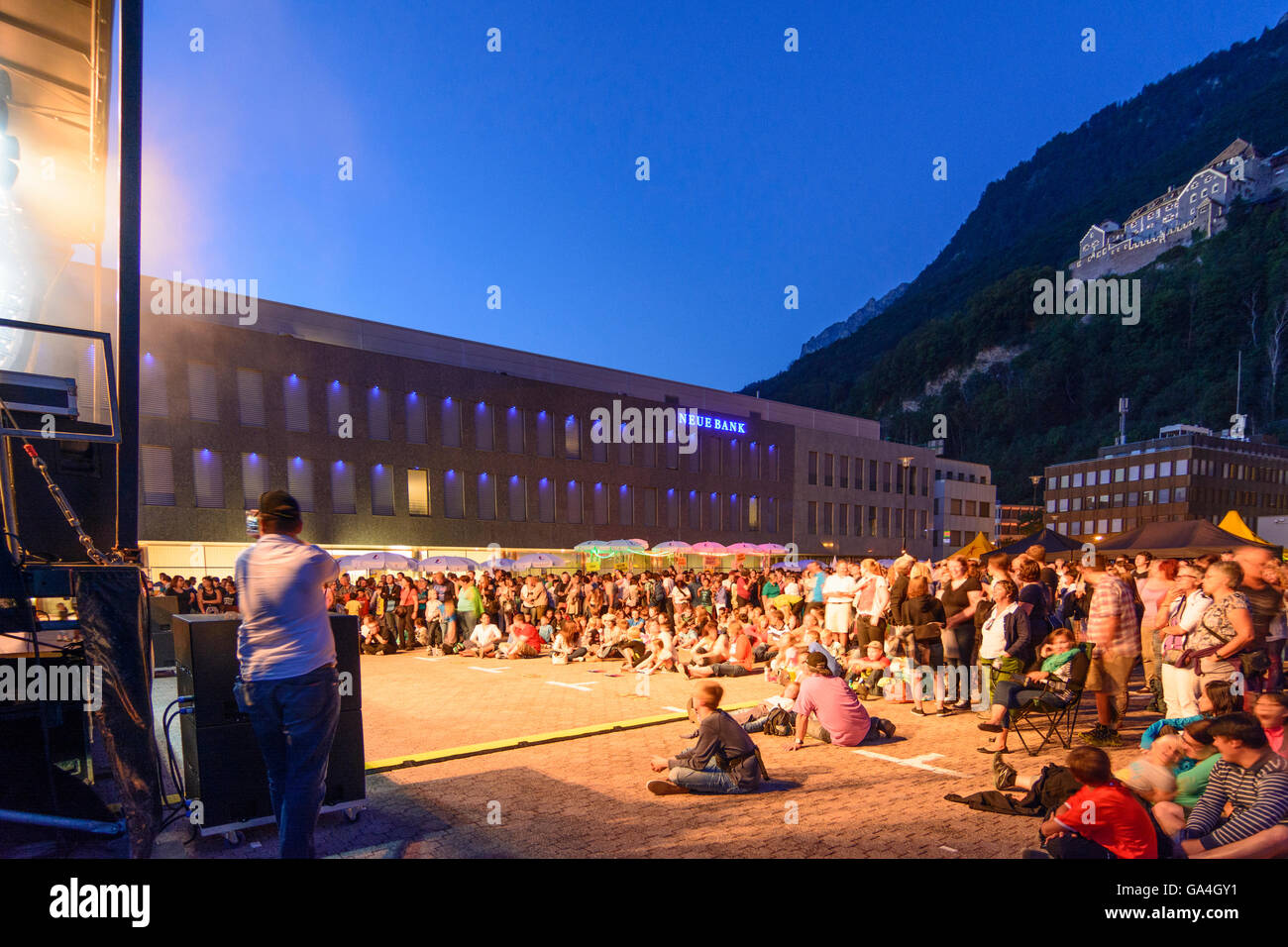 Vaduz National Day of Liechtenstein : viewers in front of stage for concerts , bank Neue Bank, Vaduz Castle Liechtenstein Stock Photo