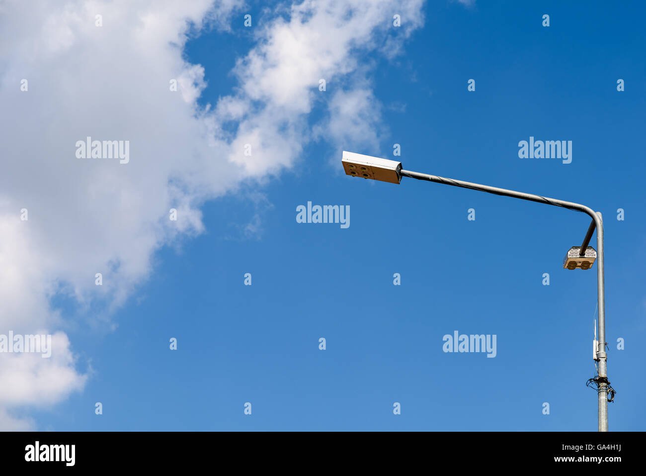 Street Light Pole Against Blue Sky Stock Photo