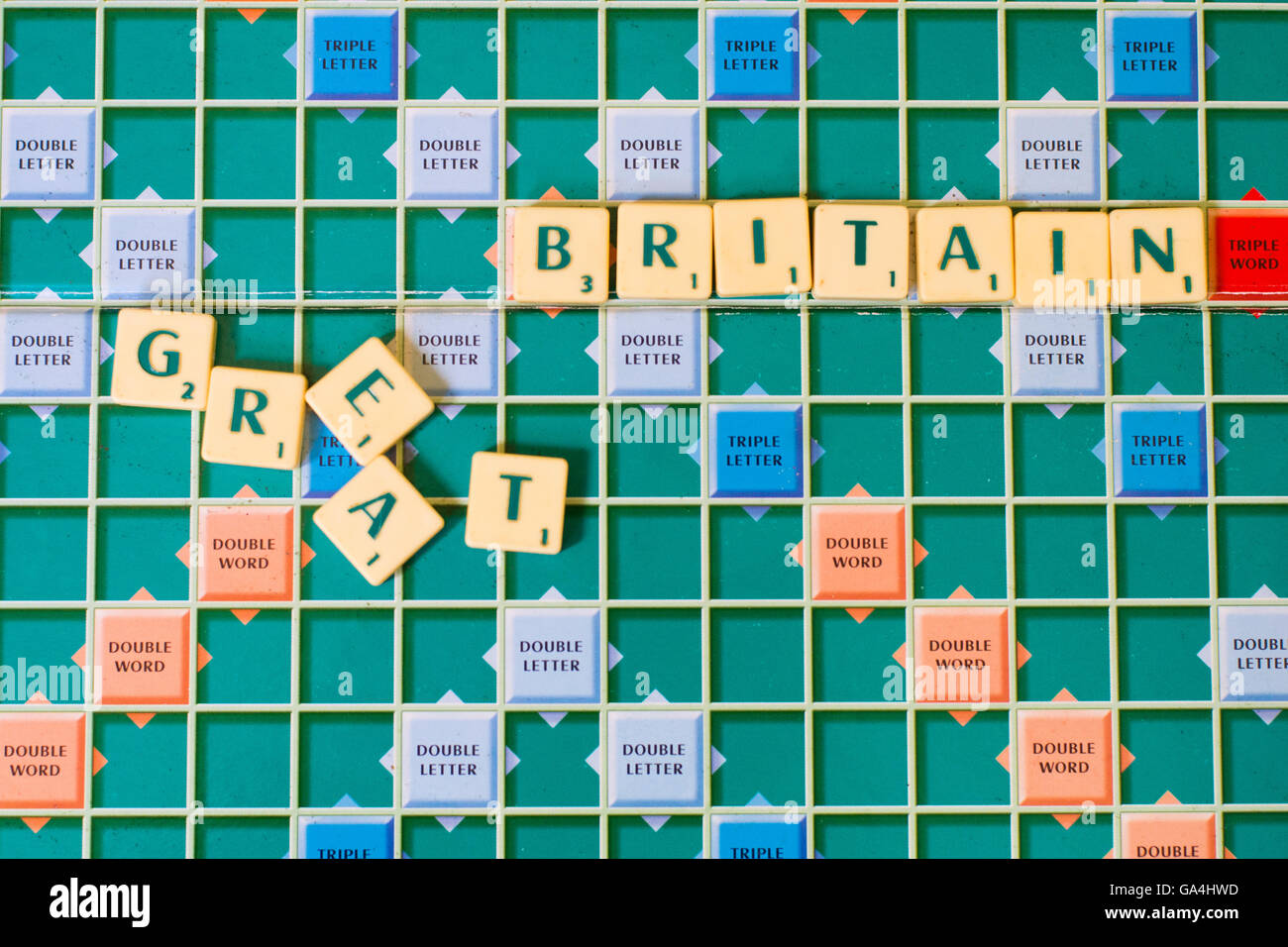 Scrabble tiles spelling out Great Britain with the Great scattered, symbolising the demise of Great Britain after a no deal Brexit Stock Photo