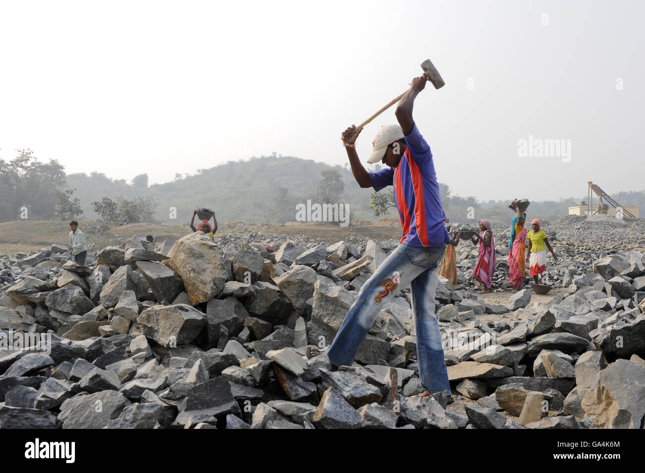 INDIA Westbengal, worker crush granite to gravel in stone quarry near
