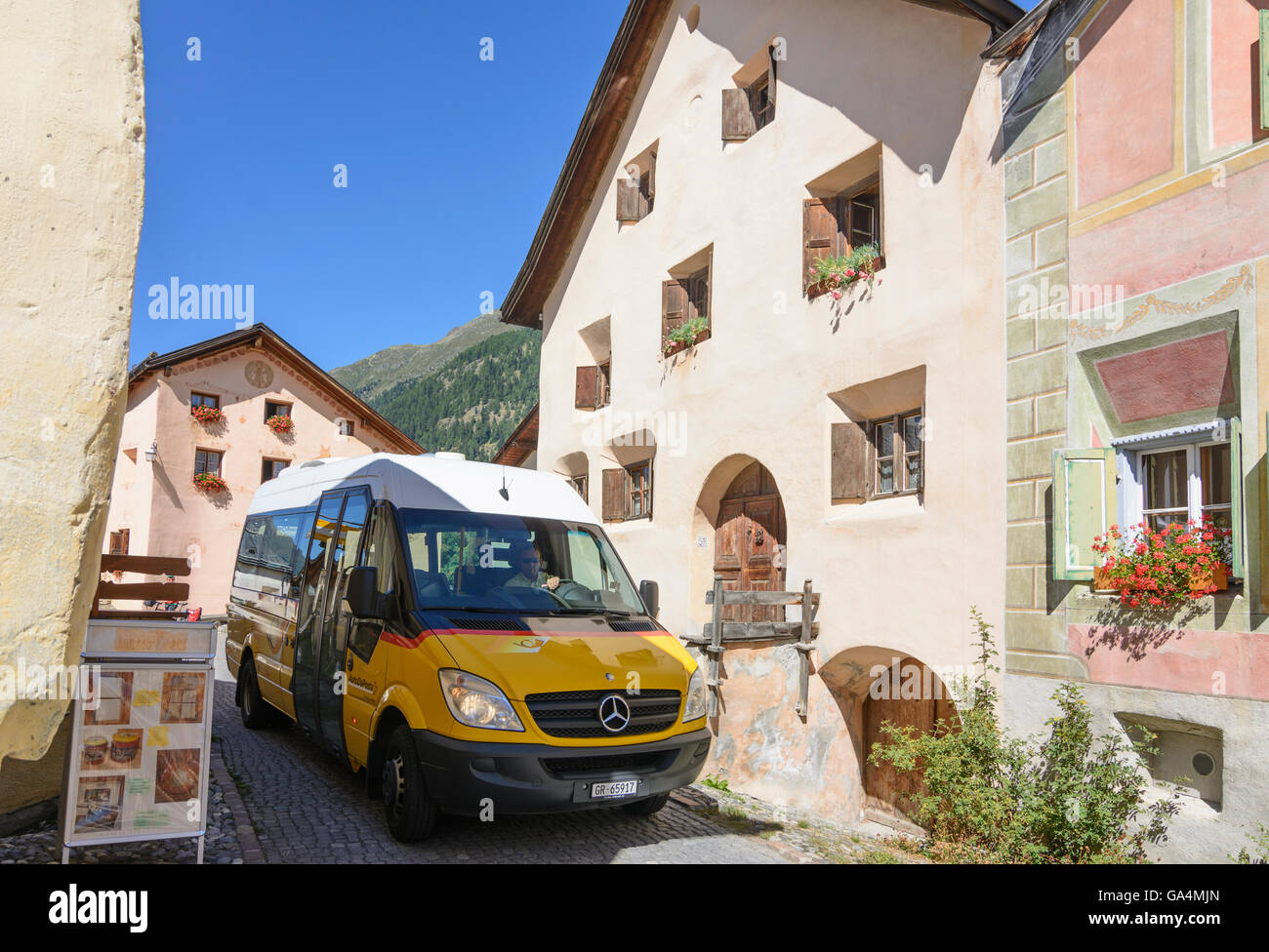 Guarda with sgraffito decorated house, bus Postbus Switzerland Graubünden, Grisons Unterengadin, Lower Engadine Stock Photo