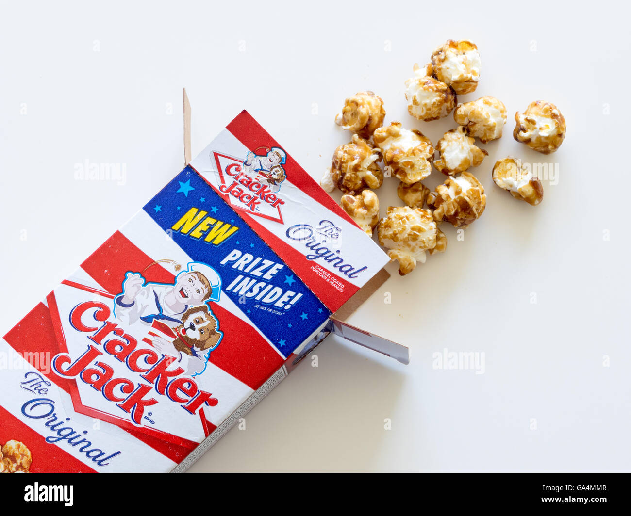 A box of Cracker Jack, an American snack consisting of molasses-flavoured caramel-coated popcorn and peanuts. Stock Photo