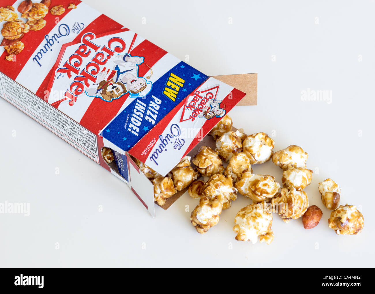 A box of Cracker Jack, an American snack consisting of molasses-flavoured caramel-coated popcorn and peanuts. Stock Photo