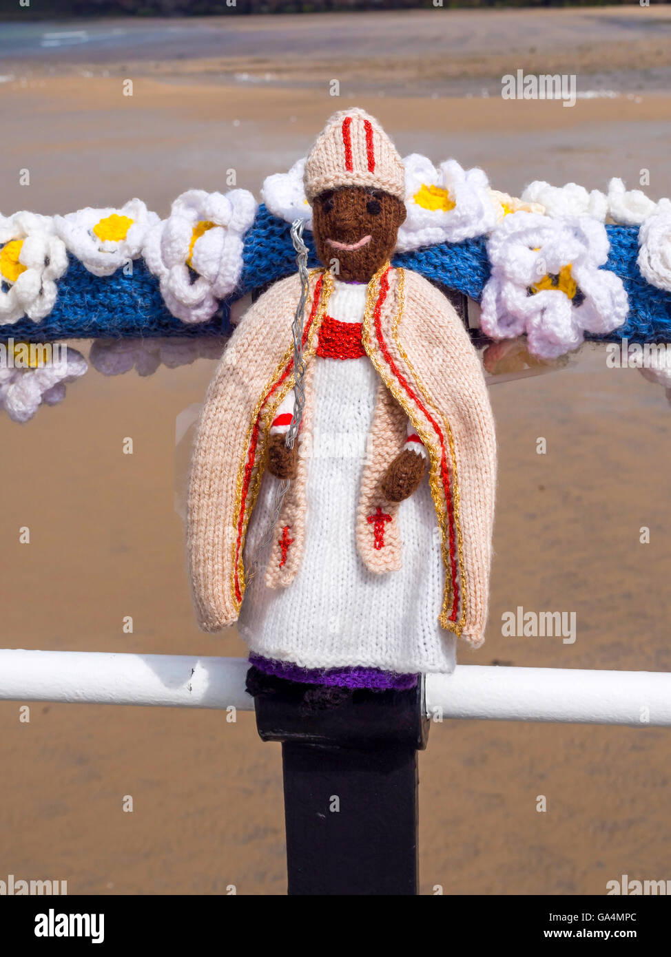 Yarn Bombing decorating public place with knitted objects here