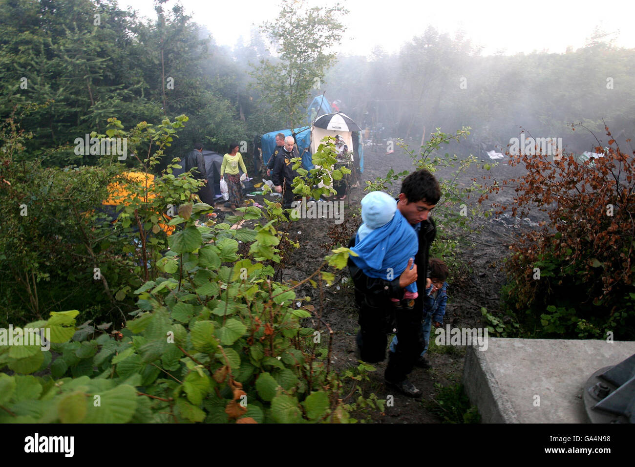 Roma gypsies leave their camp on a roundabout on the M50 at Ballymun ...