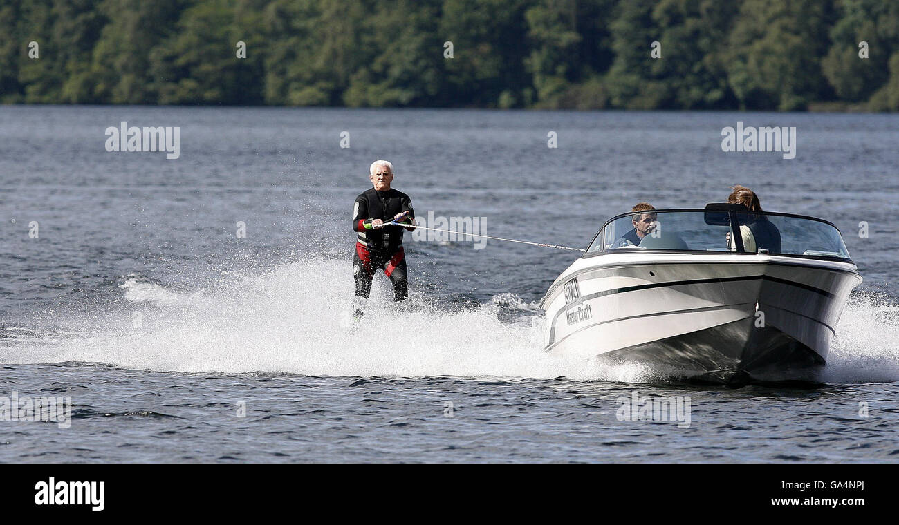 Gerald Price, a blind waterskier is towed by Kevin Furber, the driver