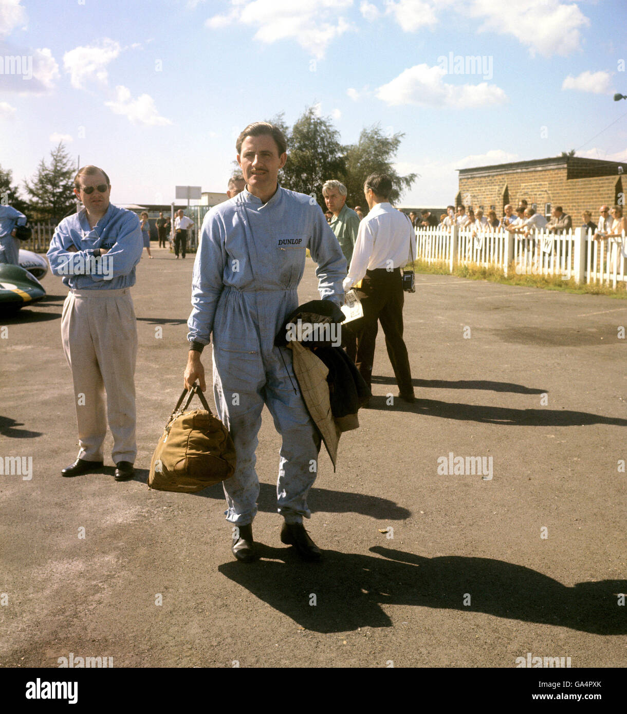 Motor Sport - Graham Hill - Goodwood. Graham Hill arrives in the paadock at Goodwood Stock Photo