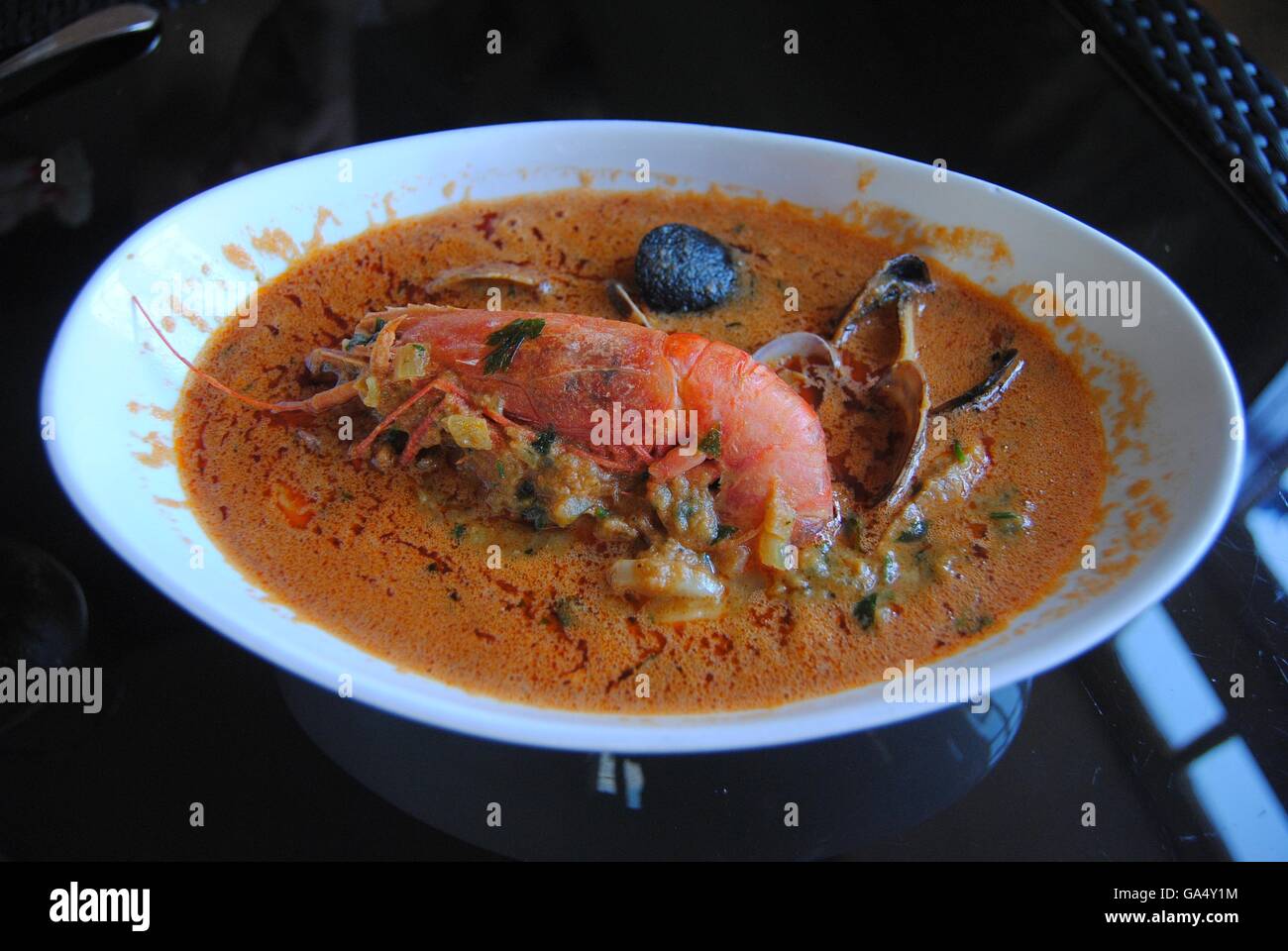 Mediterranean fish and seashell soup Stock Photo - Alamy