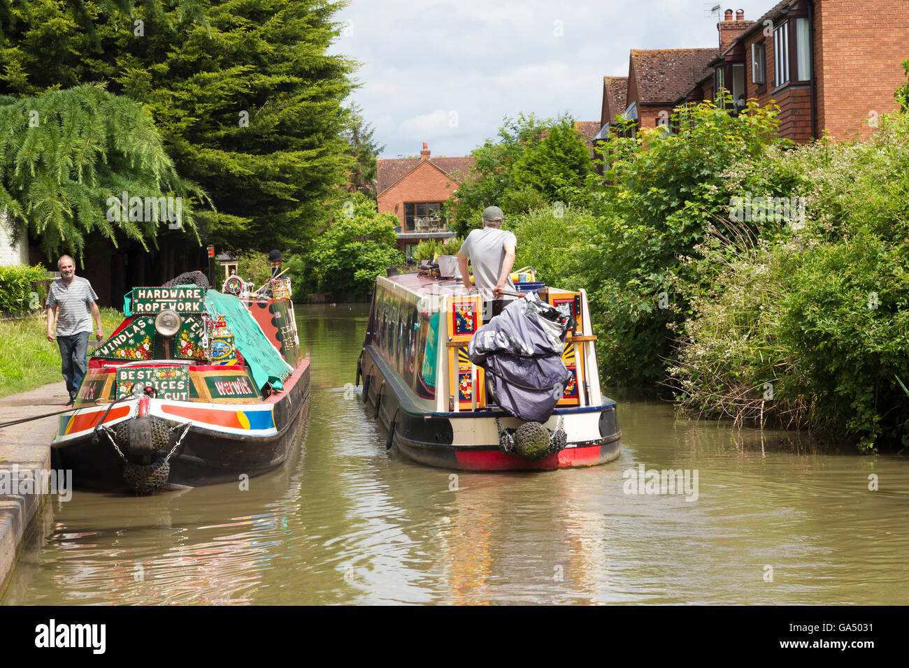 Longboats passing on the Stratford Canal, Stratford upon Avon. Stock Photo