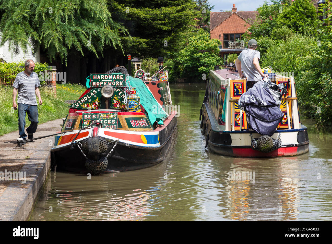 Longboats passing on the Stratford Canal, Stratford upon Avon. Stock Photo