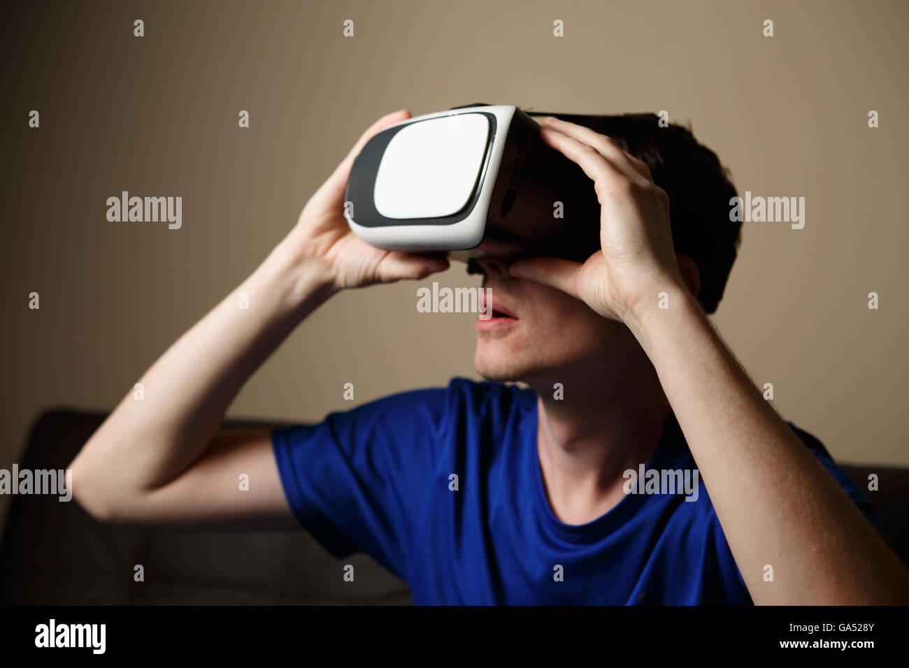 Man wearing virtual reality goggles Stock Photo - Alamy