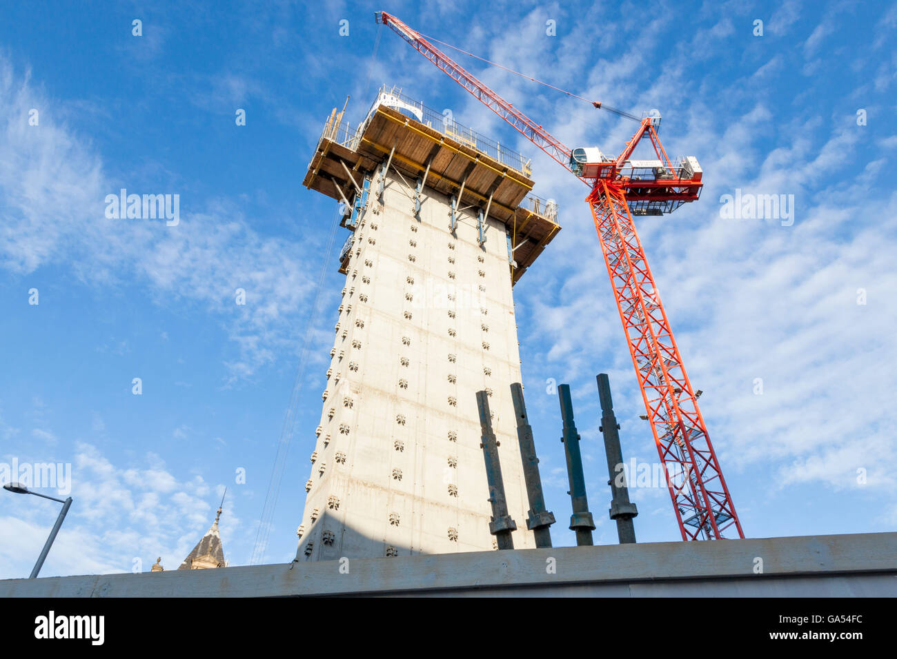 New building work. Lift shaft and tower crane on a construction site, Nottingham, England, UK Stock Photo