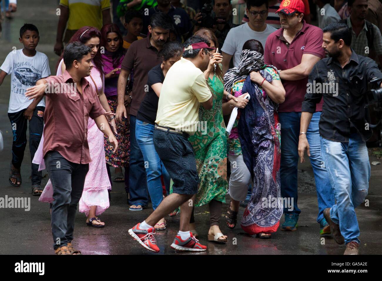 Dhaka, Bangladesh. 2nd July, 2016. Relatives of a hostage seeking news near from the Holey Artisan Bakery. Six gunmen have been shot and killed during an operation to end a hostage situation by military commandos, while the gunmen killed two policemen earlier and thirteen hostages have been rescued. Credit:  K M Asad/ZUMA Wire/Alamy Live News Stock Photo