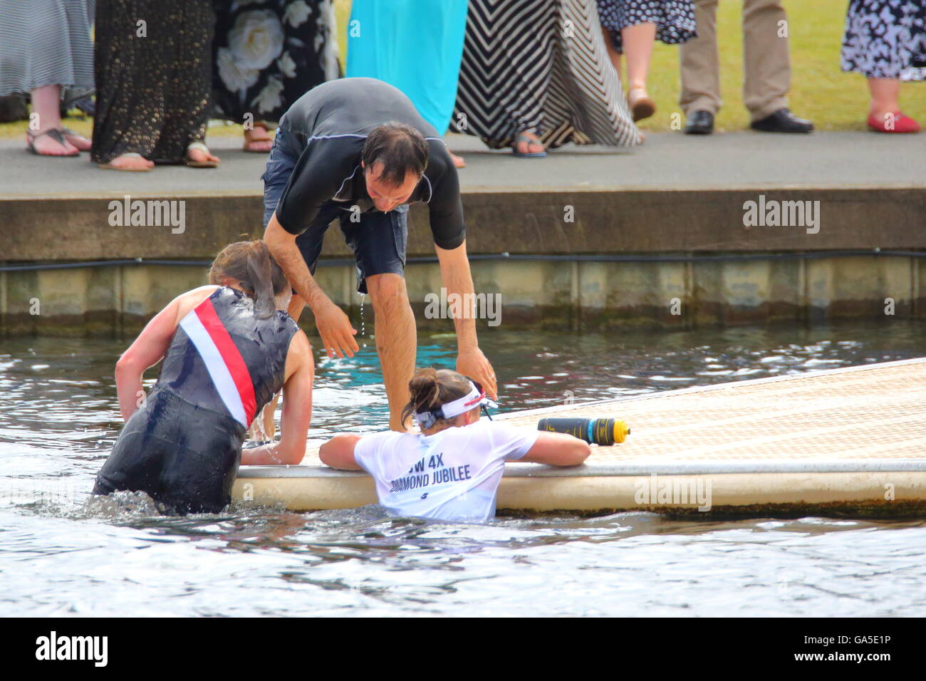 Rowers from all over the world came to the annual Henley Royal Regatta 2016. Gloucester Rowing Club celebrates their victory in the first race of the day. Stock Photo