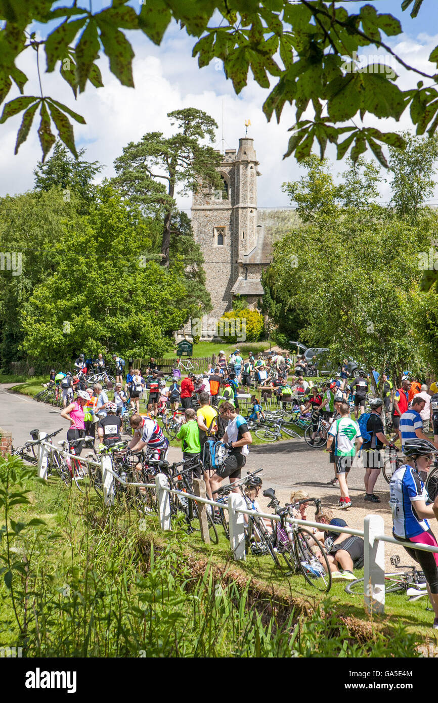 London to Cambridge bike race competitors take a refreshment break in
