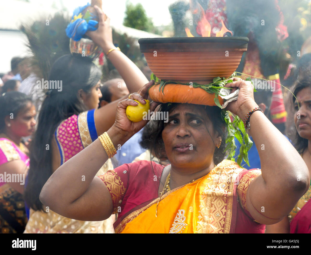 believing women with burning bowls, Sri KamadchiAmpal Temple priest
