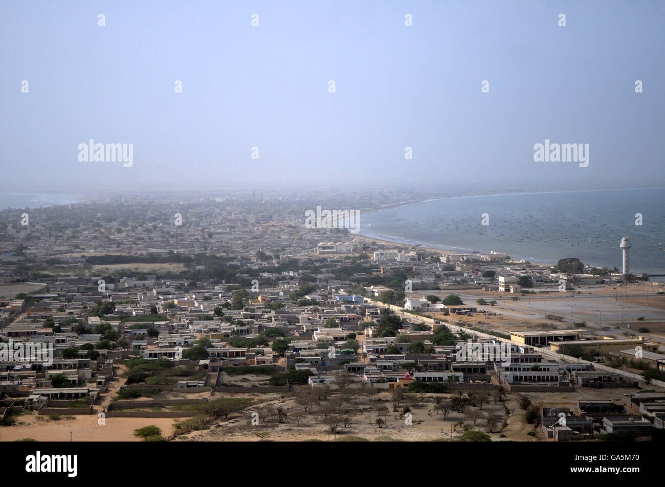 Gwadar. 2nd July, 2016. Photo taken on July 2, 2016, shows view of the city near Gwadar Port in southwest Pakistan. Gwadar Port is a warm-water, deep-sea port situated on the Arabian Sea in Balochistan province of Pakistan. China and Pakistan agreed to build China-Pakistan Economic Corridor (CPEC), a major and pilot project under the Belt and Road Initiative, to connect the Pakistani Gwadar port with Kashgar city in China's Xinjiang Uygur Autonomous Region. © Ahmad Kamal/Xinhua/Alamy Live News Stock Photo
