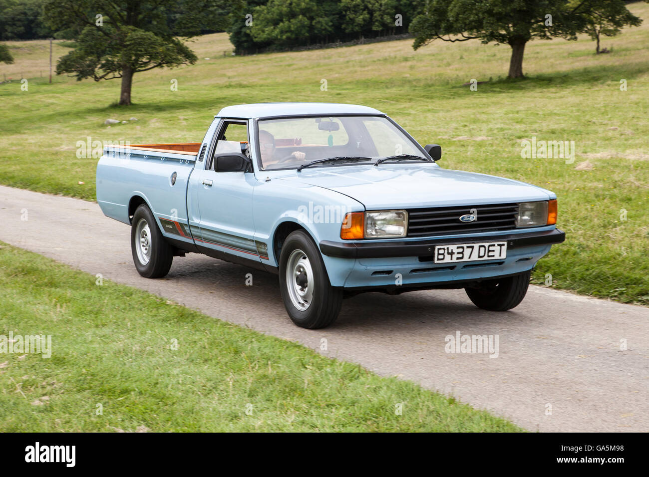 1985 blue Ford cortina van at Leighton Hall Classic Car Rally, Carnforth, Lancashire, UK.  3rd July, 2016.  The annual classic car rally takes place at the magnificent Leighton Hall in Carnforth in Lancashire.  British classic sports cars ranging from MG's to American muscle cars like the Dodge Vipers & Ford Mustangs.  The spectator event drew thousands of visitors to this scenic part of the country on the north west coast of England.  Credit:  Cernan Elias/Alamy Live News Stock Photo