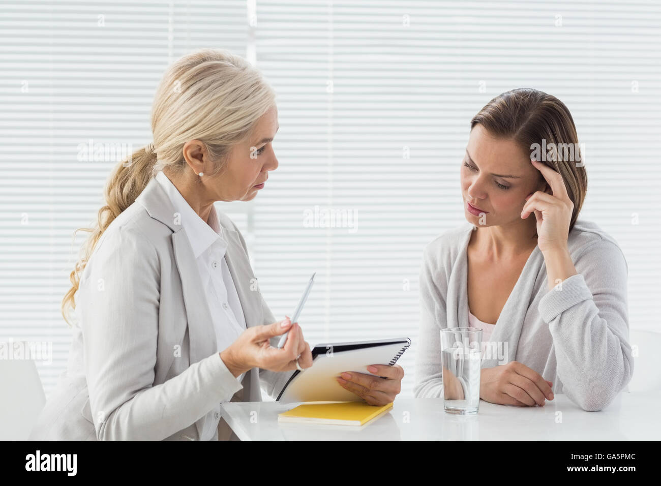 Therapist talking to her patient Stock Photo