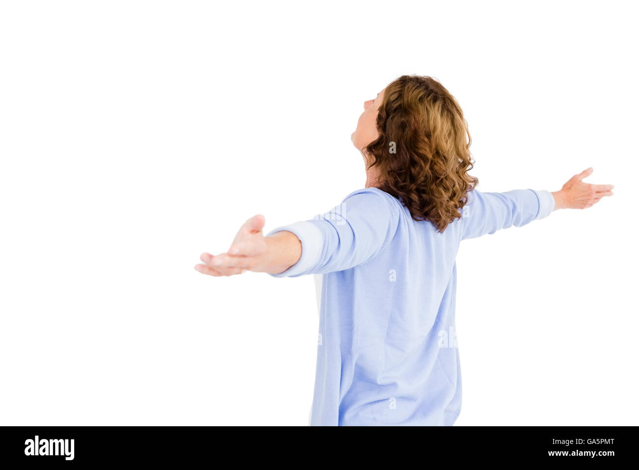 Woman with arms outstretched while praying Stock Photo Alamy