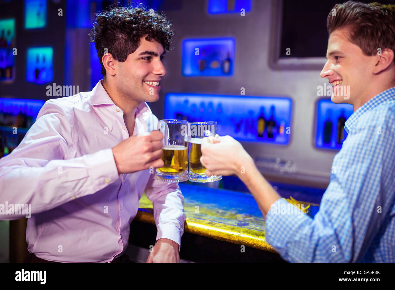 Happy friends toasting beer Stock Photo Alamy